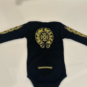 Chrome Hearts Black and Gold Bodysuit with Elegant Detailing